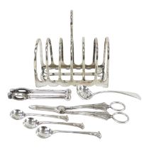 A silver plated toast rack - with seven divisions and a loop handle, width 16cm, together with a