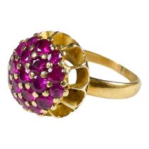 An 18ct gold ruby cluster ring - with a domed setting, size L, weight 5.7g.