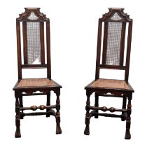 A pair of walnut 17th century style chairs - with cane seats and backs, on square and turned legs