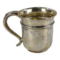 A silver christening mug - Sheffield 1931, Walker & Hall, of plain form with a high girdle and