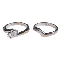 An 18ct white gold two stone diamond ring - together with a conforming wedding band, ring size J,