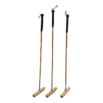 Three child's polo mallets - size 44', M.H. Geoffrey & Co. full size, with a bag.