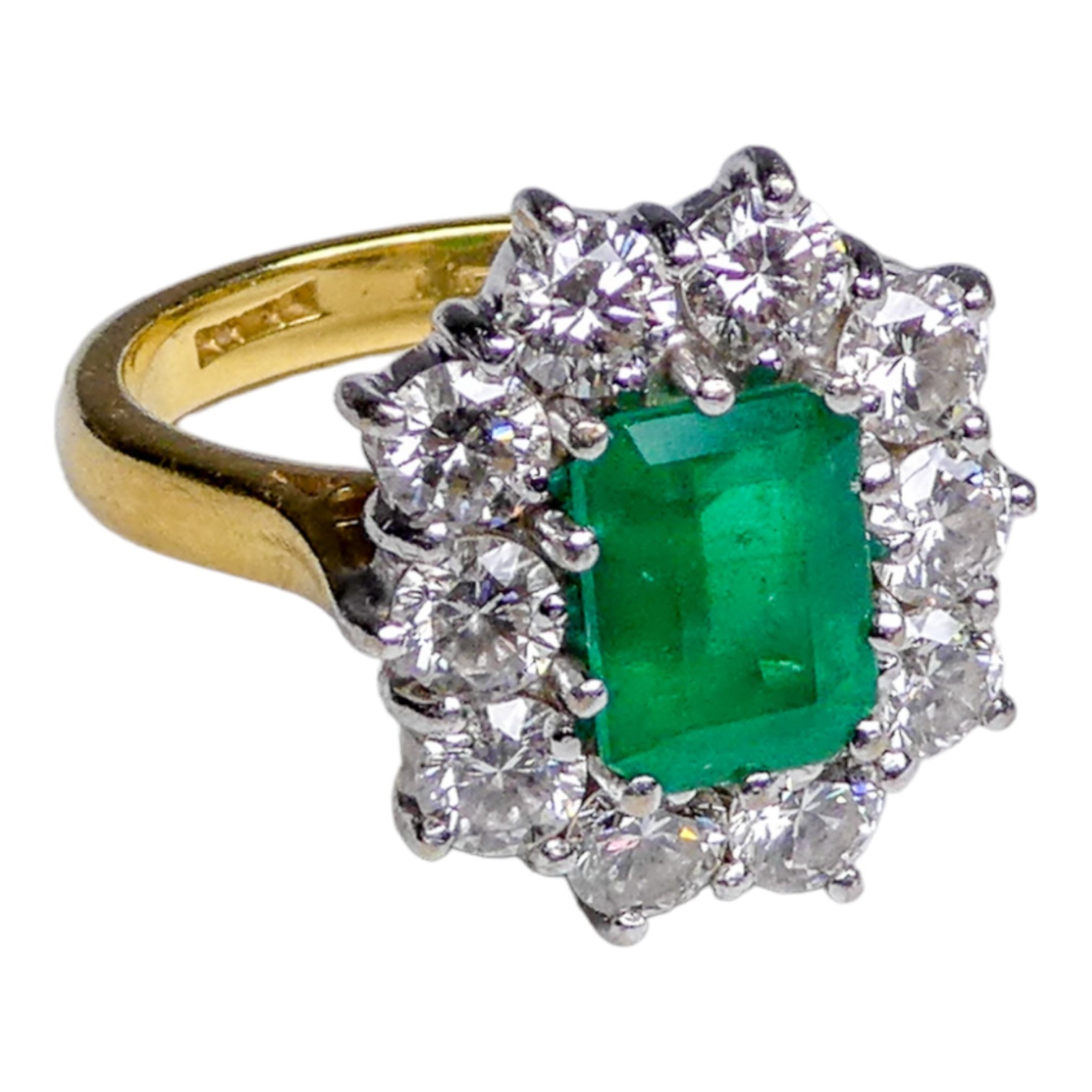 An 18ct yellow gold emerald and diamond cluster ring - size M/N, weight 8.5g.