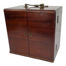 An early 19th century mahogany apothecary's chest - the top fitted with a bail handle, the double