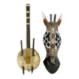 A 20th century stringed instrument - length 55cm long, together with a polychrome painted zebra