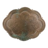 A late 19th century Anglo/Indian brass tray - of shaped oval form, with engraved, repousse and