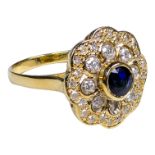 A 18ct yellow gold sapphire and diamond ring - the circular brilliant cut sapphire collet set and