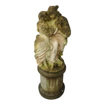 A 20th century reconstituted stone figure group - the pair of lovers raised on a stop-fluted