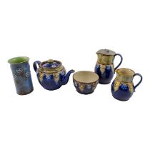 A four piece Royal Doulton tea service in the Arts and Crafts style - decorated with grey bands