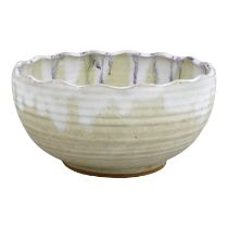 A bowl by Peter Curtis of Millbrook Pottery - of white and pink dribble glazes, diameter 21cm.