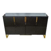 A contemporary black lacquer sideboard - the rectangular top above an arrangement of four ribbed