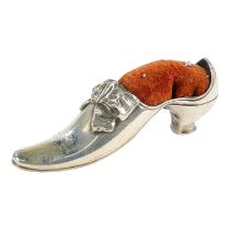 A silver pin cushion modelled as a ladies shoe - Birmingham 1904, Adie & Lovekin Ltd, length 8.5cm.