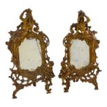 A pair of 20th century cast brass table mirrors - cast with an exotic woman and putto, stamped '