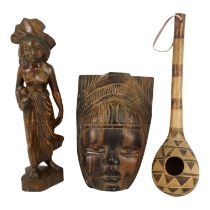 A 20th century carved hardwood African mask - of a female figure wearing a crown, height 29cm,