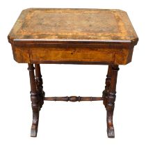 A Victorian walnut games and work table - the hinged rectangular top with canted corners opening