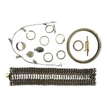 A quantity of costume jewellery - to include a heavy interlinked white metal bracelet and a plain