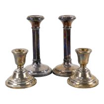 A pair of silver candlesticks - Birmingham 1968, of hexagonal form with circular weighted bases,