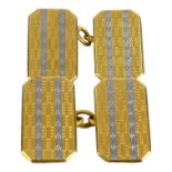 A pair of 18ct gold cufflinks - rectangular with canted corners, engine turned with a 'white'