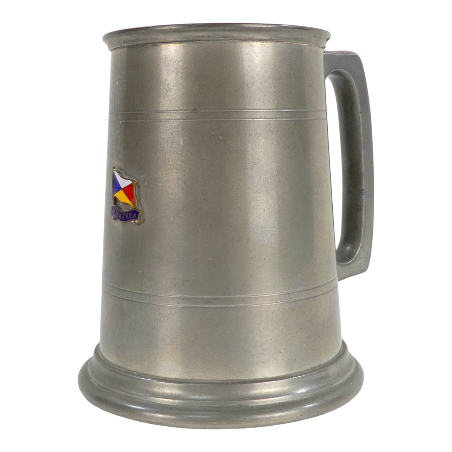 A 20th century pewter pint tankard - bearing an enamel P & O flag and emblazoned Canberra, with a