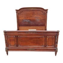 A Louis XVI style mahogany double bed - the panelled head and foot boards with fluted column