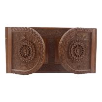 An Anglo Indian sandalwood book trough/slide - the hinged D-shaped ends elaborately carved with