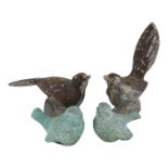 A cast lead figure of a bird - with another similar, a pair, together with a pair of cast bronze