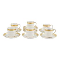 A set of six gilt Minton coffee cans - (with nine saucers) white with a gilt Greek key pattern