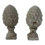A pair of contemporary reconstituted stone pineapple finials - raised on a square base, height 30cm