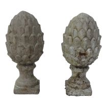 A pair of contemporary reconstituted stone pineapple finials - raised on a square base, height 30cm