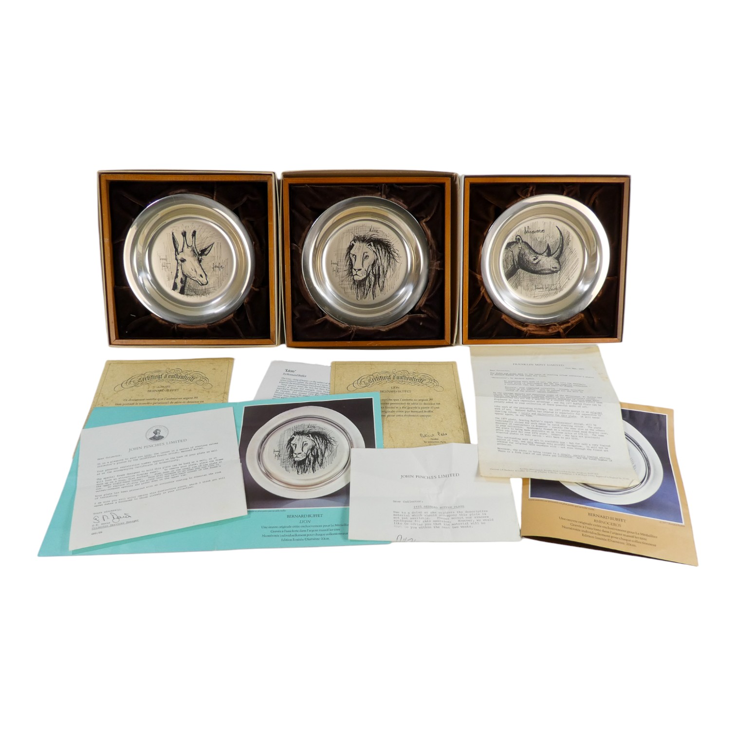 A collection of three silver plates - engraved limited editions featuring images of African