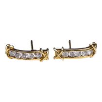 A pair of 18ct gold and diamond ear studs - weight 2.9g.