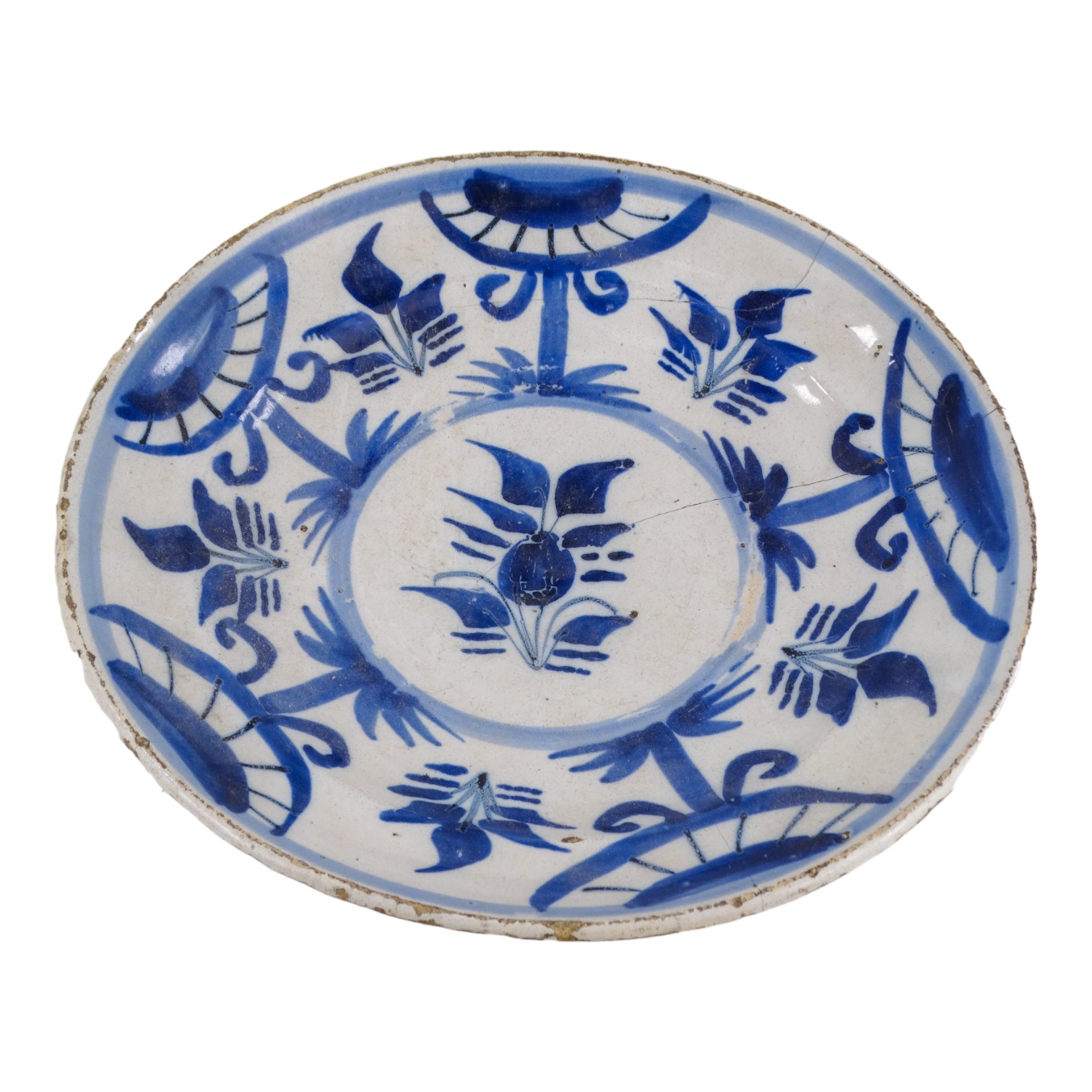 A Delft tin glazed plate - decorated with a foliate design, diameter 13cm.