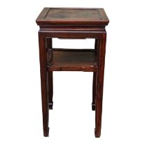 A Chinese oriental hardwood square pedestal table - the panelled top above an undertier, on square