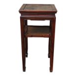 A Chinese oriental hardwood square pedestal table - the panelled top above an undertier, on square