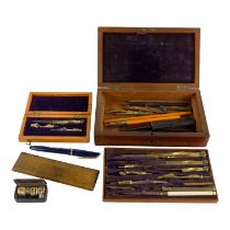 An early 20th century cased drawing set - fitted with brass instruments with a lift-out tray