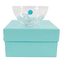 A Tiffany clear cut glass bowl - etched to base and with adhesive label, diameter 11cm, boxed.