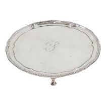 A silver waiter - London 1777, Robert Jones & John Scofield, circular ogee form with a bead rim,