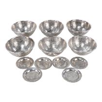 A set of six Egyptian white metal bowls - decorated with a foliate design, circa 1945, together with