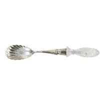 A silver serving spoon - London 1897, John Grinsell & Sons, with scallop shell bowl and cut glass