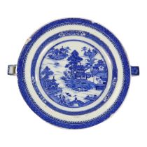 A late 19th century Chinese blue and white plate warmer - decorated with a landscape scene, diameter