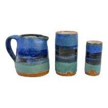 A 20th/21st century studio pottery jug - decorated in green and blue glazes, impressed with 'GH'