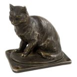 An early 20th century cast car mascot - modelled in the form of a seated cat, raised on a