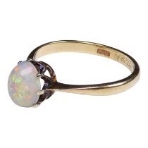 A 9ct opal ring - cabochon stone claw set on a gold band, size M, weight 1.6g.