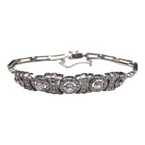 A diamond bracelet - with five primary old cut stones set on an articulated ground of multiple