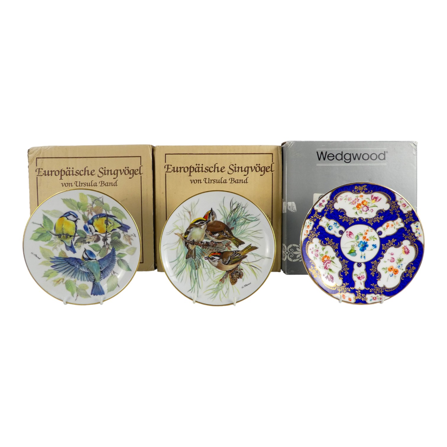 A Royal Worcester 'Heritage' plate - Scale Blue, diameter 21cm, boxed, together with two Bradford