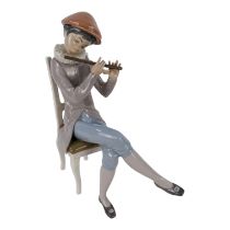 A Lladro figure of a young boy with a flute - seated, no. 4877, discontinued 1981, height 25cm.