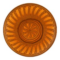 A Royal Doulton stoneware charger - orange with a petal design, diameter 34cm.