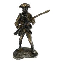 A silver model of an American Civil War soldier carrying a rifle - height 5.8cm, weight 45.5g.