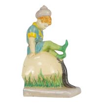 Clarice Cliff for Wilkinson Ltd - a novelty bookend circa 1936, modelled as a pixie with snail shell