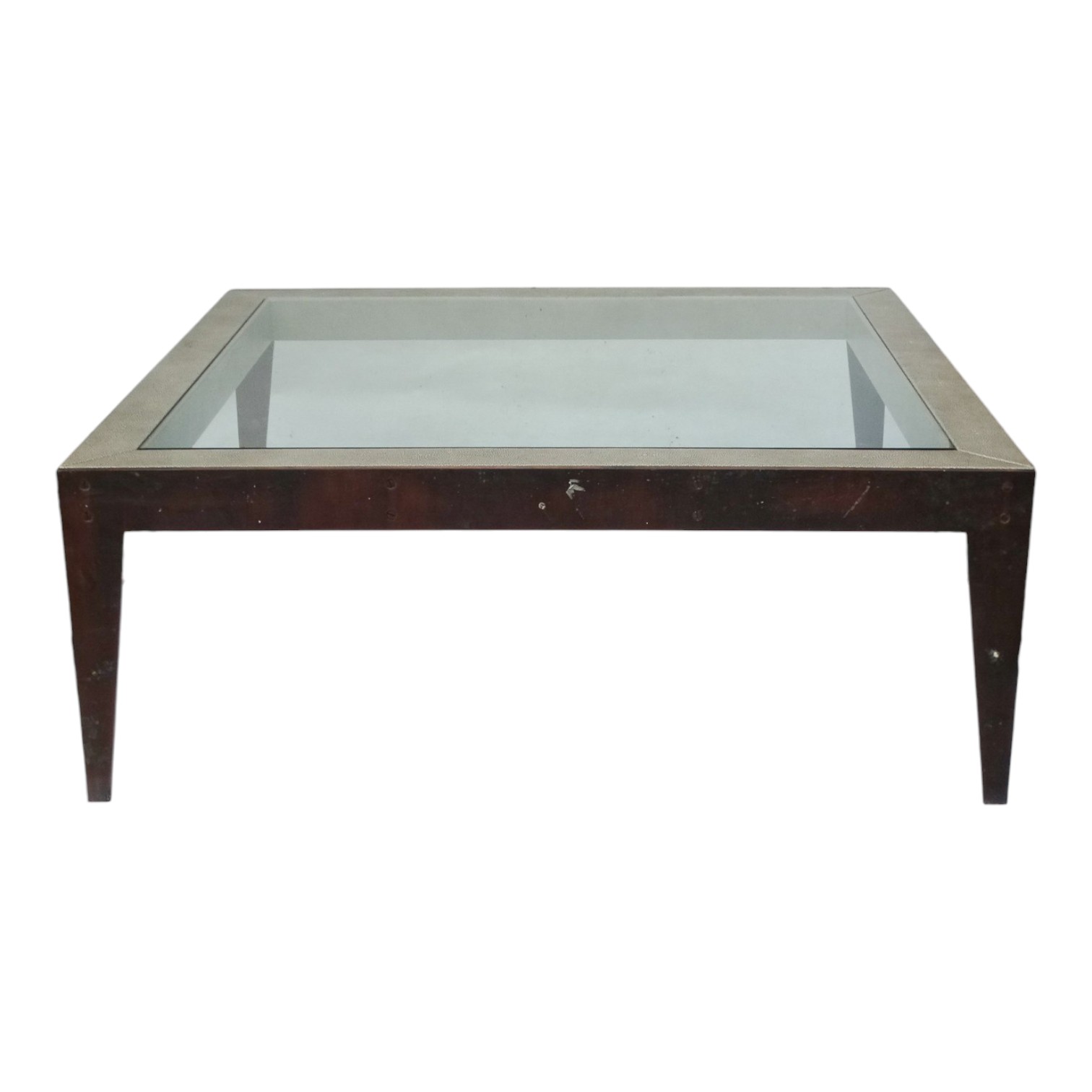 A contemporary glass and faux shagreen coffee table - square and raised on tapering profile bronze